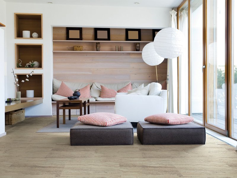 gray sofa on a brown laminate floor for living room at The Wholesale Flooring Company in Myrtle Beach, SC