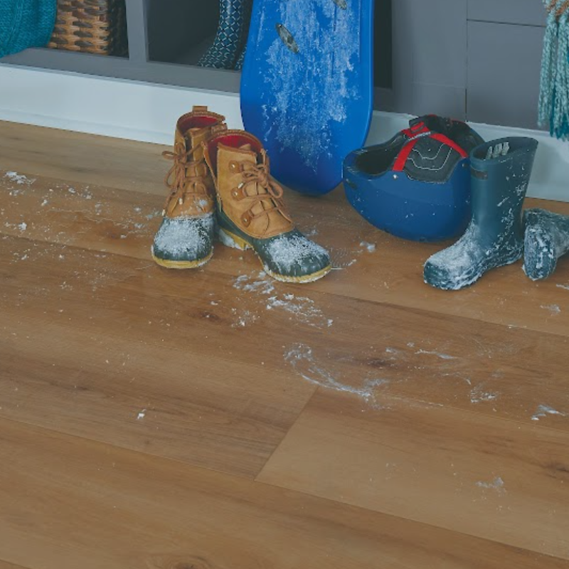 Entryway with snow covered boots on a waterproof SolidTech floor